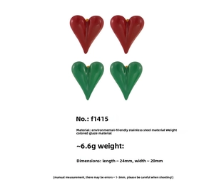 Macro detail of red and green enamel heart earrings in 24x20mm stainless steel