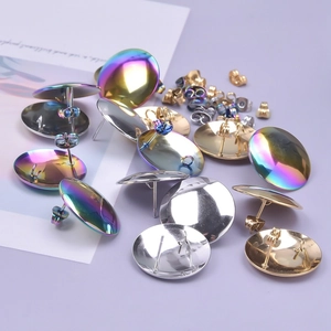 Close-up of DIY 304 stainless steel stud earring bases and butterfly backs in mixed colors