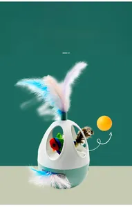 Detail of the interactive cat toy showing replaceable teaser balls and colorful feathers