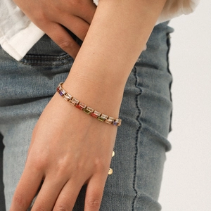 18K gold stainless steel bracelet featuring multi-color rectangular zircon stones worn on wrist