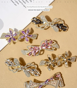 Macro shot of elegant crystal hair clips with pearl accents on alloy floral base