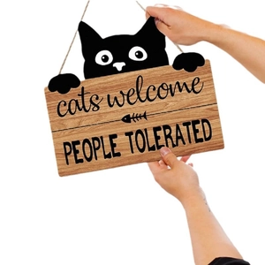 Funny cat welcome sign made of wood with fishbone pattern and people tolerated text