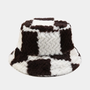Macro detail of plush faux fur texture on black and white checkerboard bucket hat