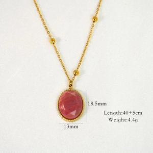 Detail view of gold beaded chain necklace with pink oval stone and product dimensions