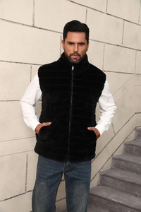 Detail of men's black faux fur vest featuring a stand collar and horizontal fur texture