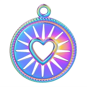 Detail of round rainbow stainless steel pendant with heart cutout and textured edges