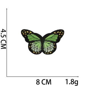 Detailed view of butterfly embroidery patch in green with size dimensions 4.5cm x 8cm
