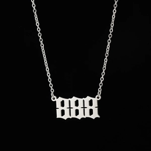 Close-up of silver gothic 888 angel number pendant with a fine O-link chain necklace