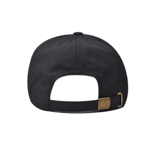 Detail view of black breathable mesh fabric and bronze metal buckle on the quick-dry cap