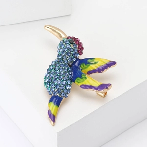 Exquisite gold hummingbird brooch with blue rhinestones and colorful enamel wings