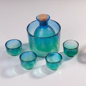 Japanese hammered peacock blue glass sake set with carafe, ice bucket, and four cups