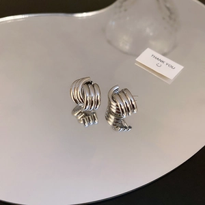 Silver twist knot geometric earrings with luxury mirror reflection and metallic finish