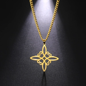 Golden Celtic Knot pendant necklace on black background under professional spotlight