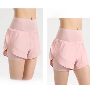 Detail view of high-waist pink sports shorts featuring 2-in-1 anti-exposure inner lining