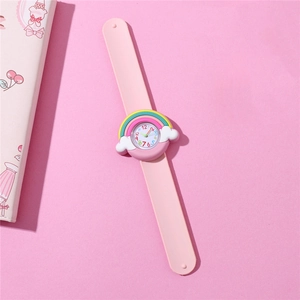 Pink cartoon snap watch featuring rainbow cloud dial and silicone band on pink background