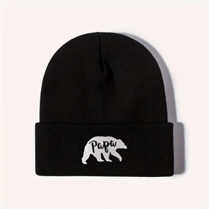 Black knitted beanie featuring a white polar bear embroidery with Papa text on the cuff
