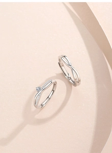 Macro shot of S925 sterling silver Mobius rings showing S925 stamp and cubic zirconia
