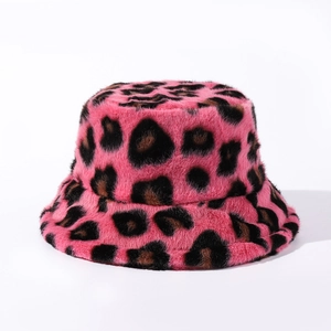 Detailed texture of pink leopard print faux fur plush bucket hat with vibrant soft fibers