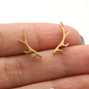 Polished gold elk antler stud earrings for women in a minimalist forest style design