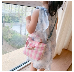Pink checkered canvas messenger bag for kids featuring embroidered letters and long strap
