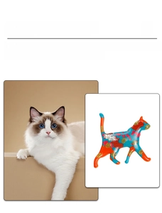 Close-up of colorful enamel cat brooch with vibrant splatters and golden glitter accents