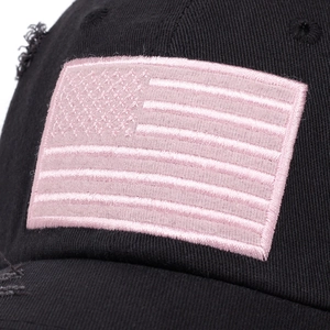 Distressed black cotton baseball cap featuring pink American flag embroidery detail