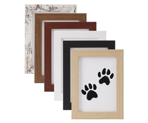 Macro display of six different wood finish pet paw print memorial frames on white background