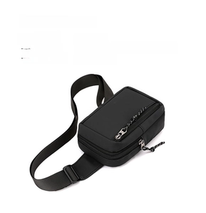 Detailed macro view of high-density nylon fabric and smooth zipper on black chest bag