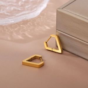 Minimalist V-shaped triangle hoop earrings in 18K gold plating with a brushed finish