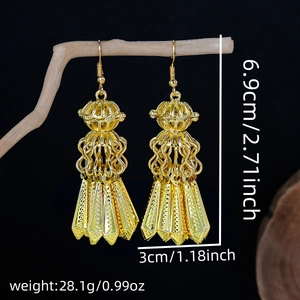 Detailed view of bohemian golden lantern earrings showing 6.9cm height and 3cm width dimensions