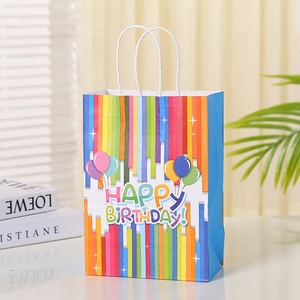 Rainbow striped Happy Birthday gift bag with white paper handles and balloon graphics