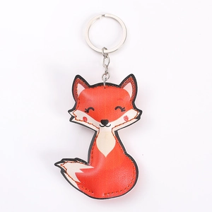 Cute red PU leather fox keychain with stuffed cotton and durable metal ring on white background