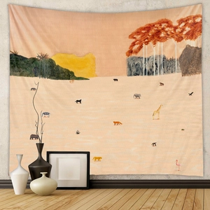 Detail of bohemian animal tapestry on wall with zebras and giraffes in warm tones