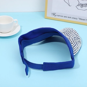 Detailed view of blue sun visor with sparkling silver rhinestones and adjustable strap
