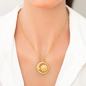 18k gold plated stainless steel necklace with sun and moon pendant worn by model