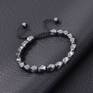 Adjustable black hematite magnetic bracelet with irregular beads on leather texture