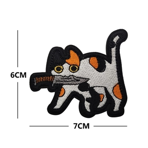 Detailed view of cat with knife embroidery patch showing 7cm by 6cm dimensions