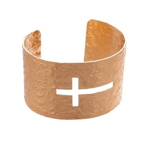 Golden open cuff bracelet featuring hammered texture and hollow cross geometric design