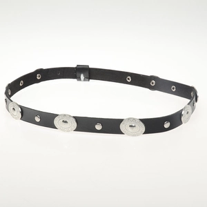Detail of black leather cord featuring embossed round silver metal studs and buckle