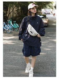 Outdoor navy sports set with functional hoodie, shorts and a white crossbody chest bag