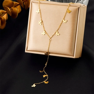 Detail of gold-plated stainless steel Y-shaped necklace featuring delicate butterfly charms