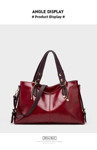 Wine red leather shoulder handbag detail showing large capacity, premium cowhide and hardware.
