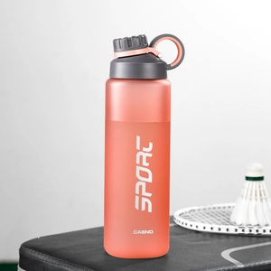 Macro detail of frosted orange sport water bottle with portable strap and sport logo