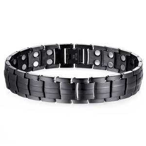 Men's black magnetic titanium steel therapy bracelet with double-row magnets and fold-over clasp