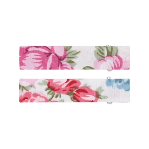 Close-up of two floral fabric-wrapped hair clips with pink roses on a white background
