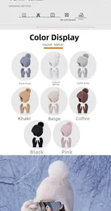 Detailed view of the thick knitted winter set texture including pompom hat and gloves