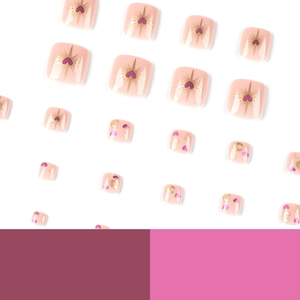 Pink press-on toe nails with golden star, moon and purple heart patterns for pedicure DIY