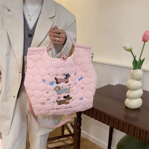 Pink quilted tote bag with cute cartoon dachshund embroidery and Have a nice day text