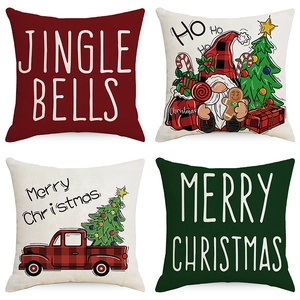 Set of four Christmas pillow covers with festive gnome and bell designs on white background