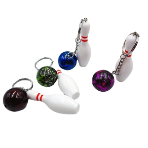 Mini bowling keychain set with white pins and marble texture balls in four colors